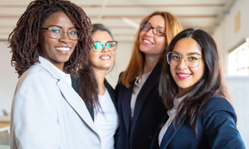 Portrait of 4 smiling women.
